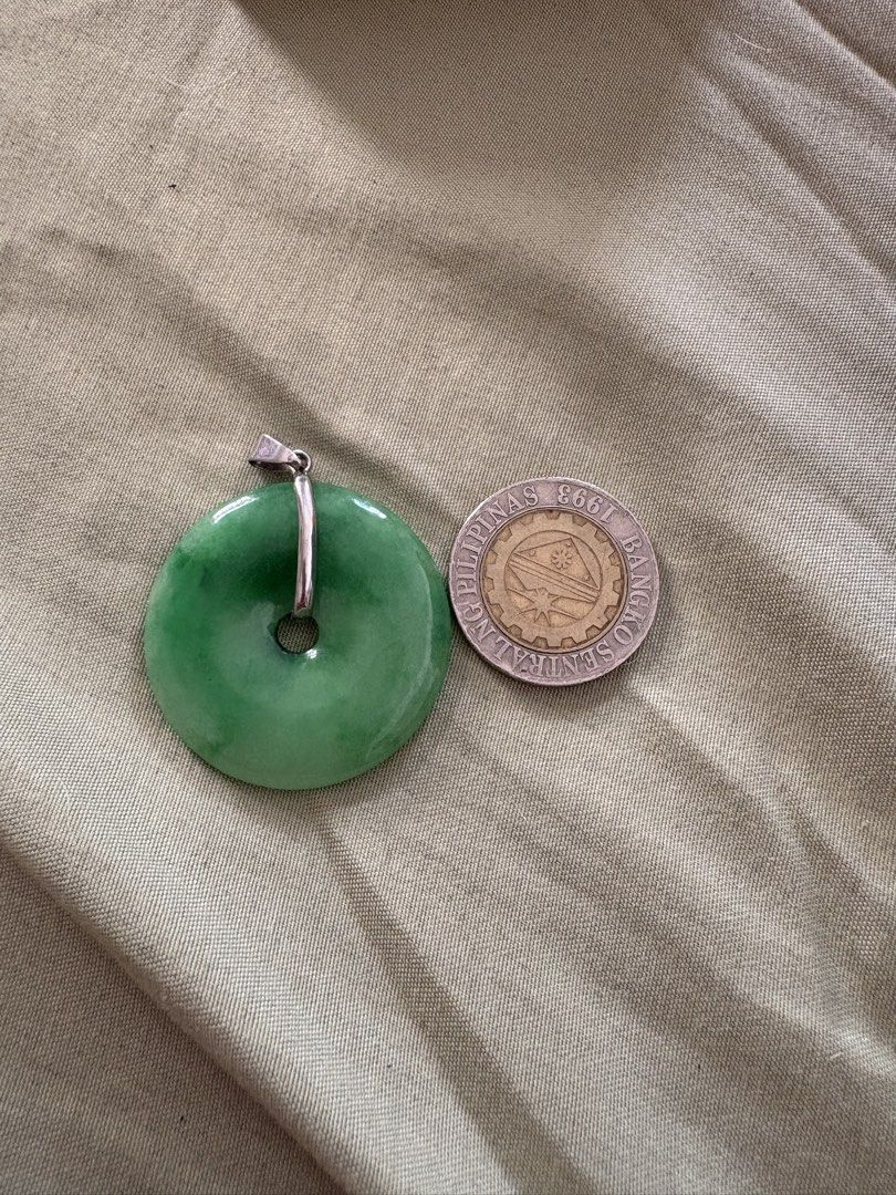 Green Jade Donut Pendant with Silver Bail (Category: Necklaces) located in Quezon City. Submitted by brandedthingsforless (Listing ID 1467888630, Image 3). Description: - Authentic natural green jade donut pendant - Features a sleek silver-tone bail - Classic Chinese coin design with lovely translucent green tones - Good size (approximately the width of a standard coin) - Comes in a small brown gift box with dark foam insert, ready for gifting Bo