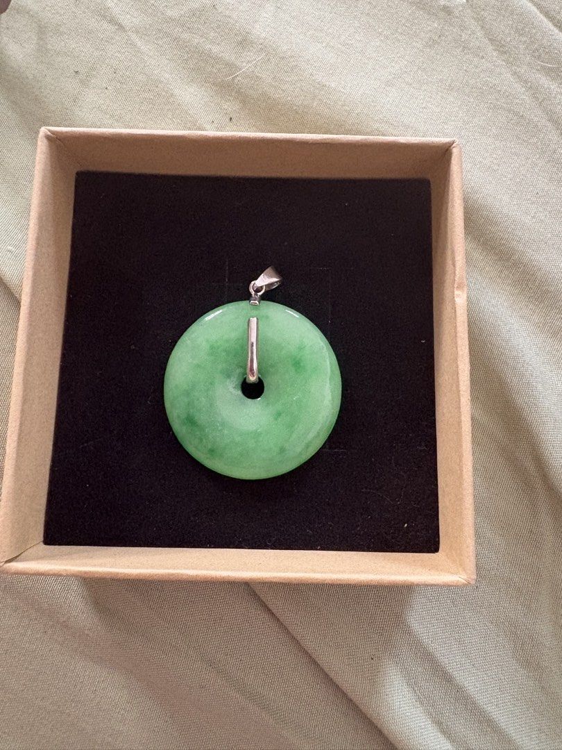 Green Jade Donut Pendant with Silver Bail (Category: Necklaces) located in Quezon City. Submitted by brandedthingsforless (Listing ID 1467888630, Image 2). Description: - Authentic natural green jade donut pendant - Features a sleek silver-tone bail - Classic Chinese coin design with lovely translucent green tones - Good size (approximately the width of a standard coin) - Comes in a small brown gift box with dark foam insert, ready for gifting Bo