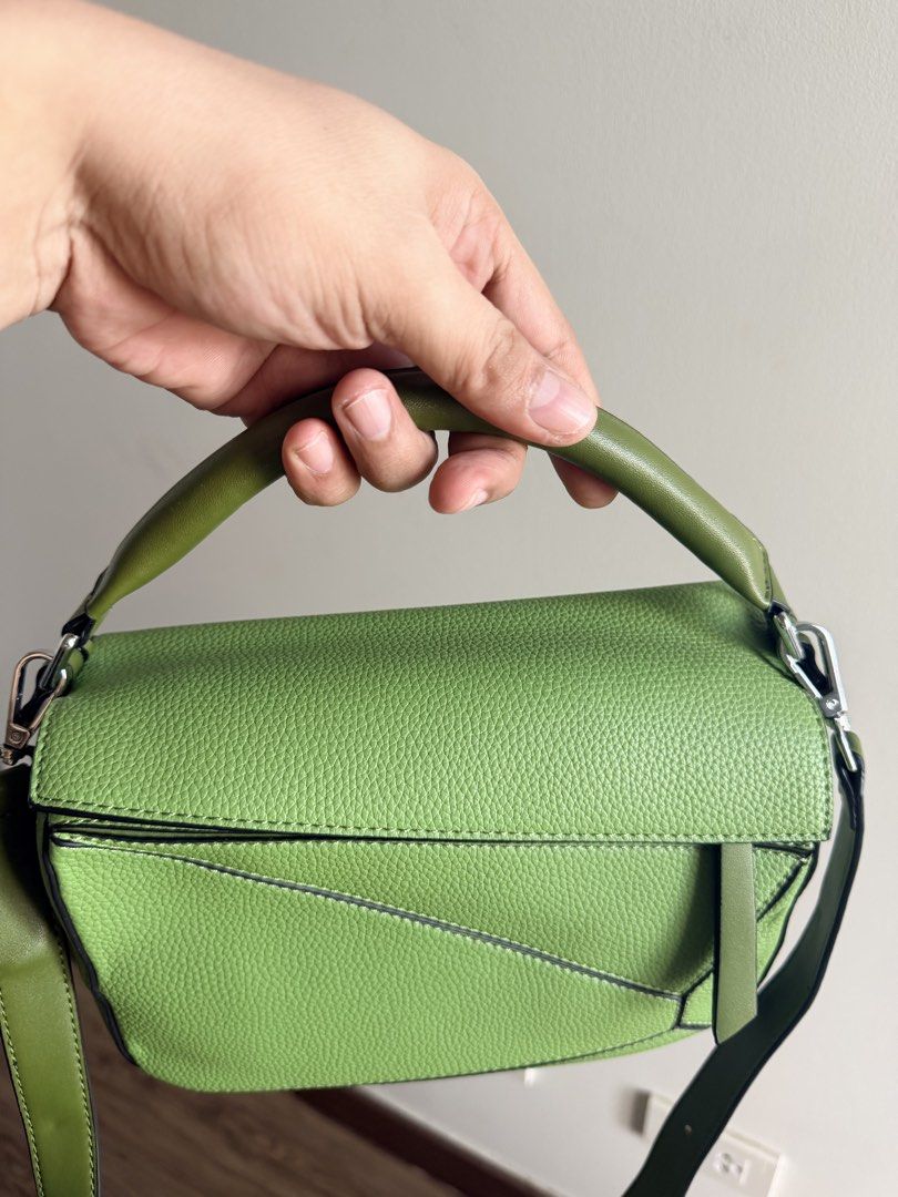 Green Puzzle Bag Crossbody Handbag (Category: Cross-body Bags) located in Paranaque City. Submitted by kimkurtt (Listing ID 1467897653, Image 3). Description: - Style: Geometric stitched leather puzzle handbag - Color: Vibrant green (great pop of color for daily outfits) - Carry Options: Top handle and included adjustable shoulder strap - Hardware & Closure: Silver-tone hardware with secure top zip closure - Interior: Fabric-lined with 1 zip pock