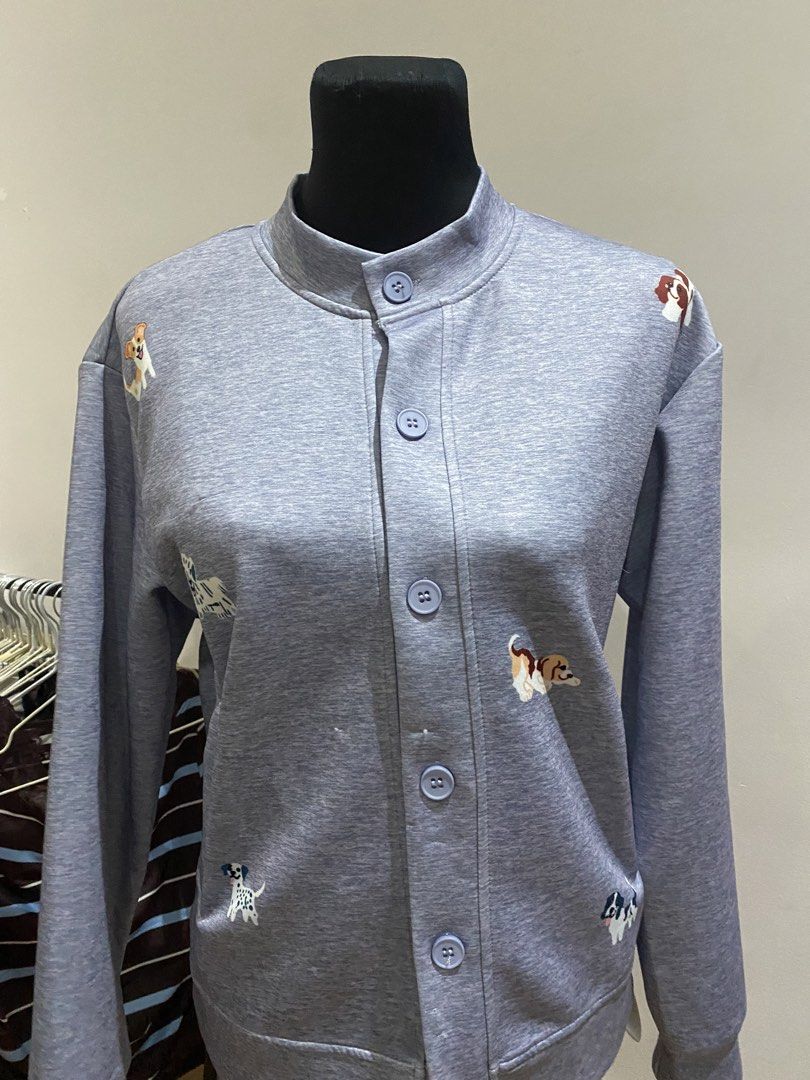 Grey Dog Print Button Up Cardigan Sweatshirt (Category: Longsleeves) located in Manila. Submitted by mpt99876 (Listing ID 1467992565, Image 2). Description: - Color & Style: Grey heather knit cardigan with a relaxed fit and mock neck - Design: Cute all-over dog embroidery with matching light blue buttons - Material: Soft and cozy sweatshirt fabric - Features: Long sleeves, button-front closure, ribbed hem and cuffs - Perfect for: Dog lovers and e