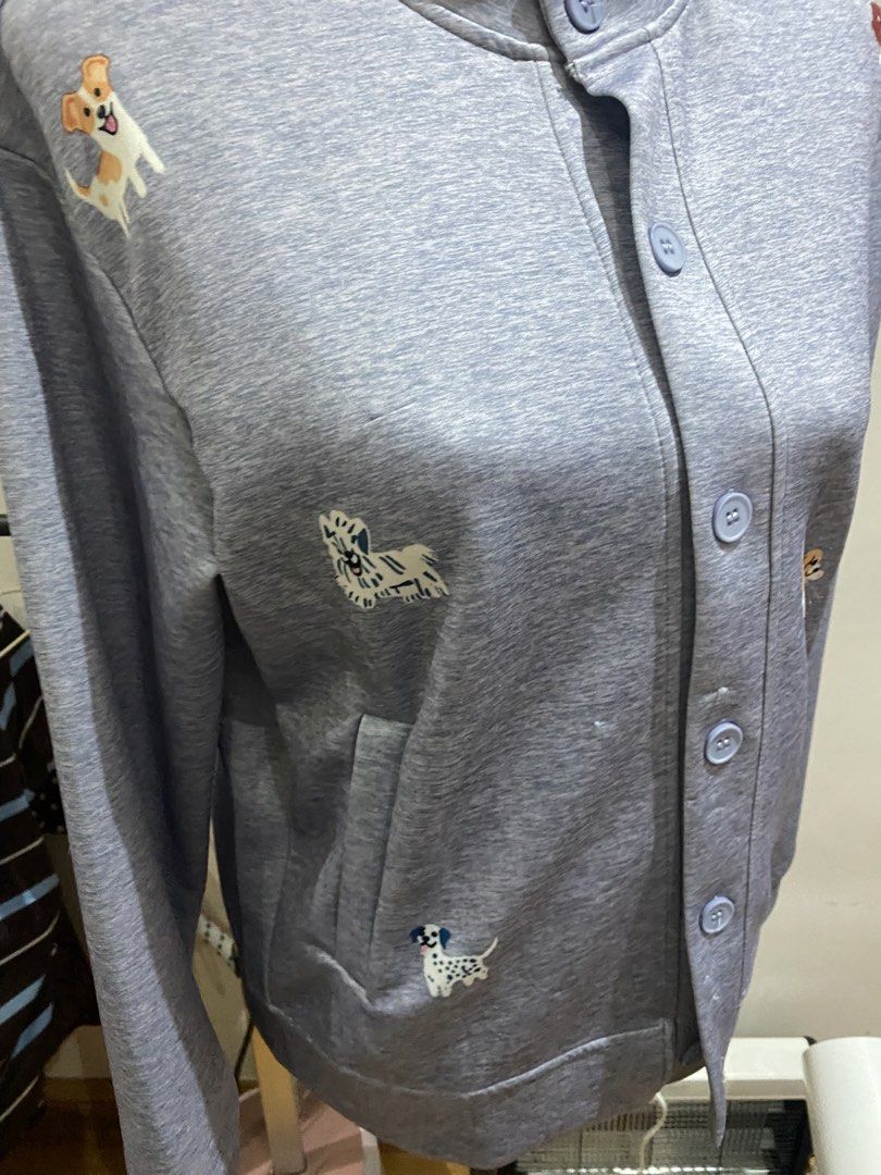 Grey Dog Print Button Up Cardigan Sweatshirt (Category: Longsleeves) located in Manila. Submitted by mpt99876 (Listing ID 1467992565, Image 3). Description: - Color & Style: Grey heather knit cardigan with a relaxed fit and mock neck - Design: Cute all-over dog embroidery with matching light blue buttons - Material: Soft and cozy sweatshirt fabric - Features: Long sleeves, button-front closure, ribbed hem and cuffs - Perfect for: Dog lovers and e