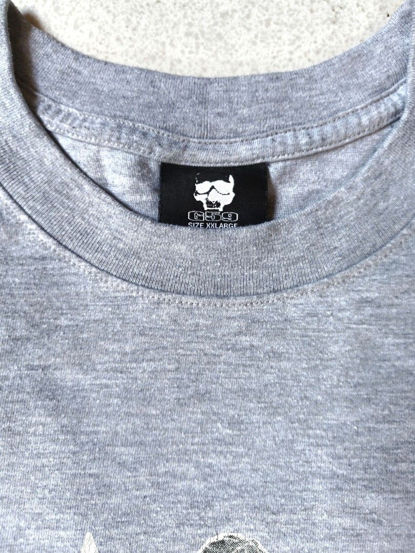 Grey five nine graphic tee (Category: Tshirts & Polo Shirts ) located in Tarlac. Submitted by thrifty_scavenger (Listing ID 1467871784, Image 3). Description: XXL on tag (29x23-23.5) issue: hairline cracks on print, minimal lints and light stain (lower part near hem) not your usual g59 merch. iykyk🔥.