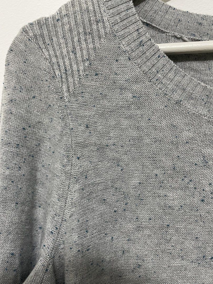 Grey knit long sleeve sweater (Category: Longsleeves) located in Santa Rosa. Submitted by saksthriftavenue (Listing ID 1467945182, Image 2). Description: Cozy grey knit sweater with blue speckles, scoop neck, and ribbed details. Perfect for winter layering with jeans or skirts. Removed tags but this is brand new Armpit to armpit: 19 inches Lenth: 28 inches .
