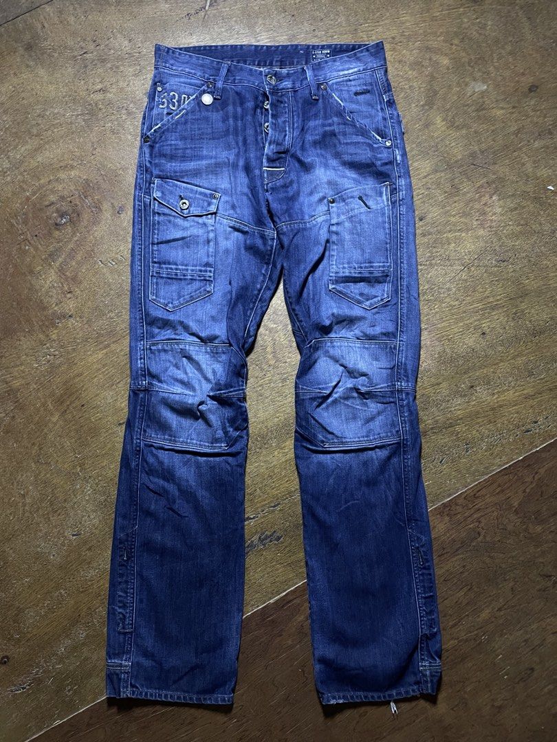 G-Star Raw 3301 Cargo Denim Jeans (Category: Jeans) located in Molave. Submitted by charlesthrifter (Listing ID 1467884296, Image 1). Description: - Brand: G-Star Raw 3301 - Type: Blue denim cargo jeans - Size: 30" waist / 34" length - Closure: Button fly - Pockets: Multiple cargo pockets on legs and back - Details: Articulated knee panels and distressed wash - Origin: Made in India - Style: Heavy utilitarian streetwear piece 34-35.