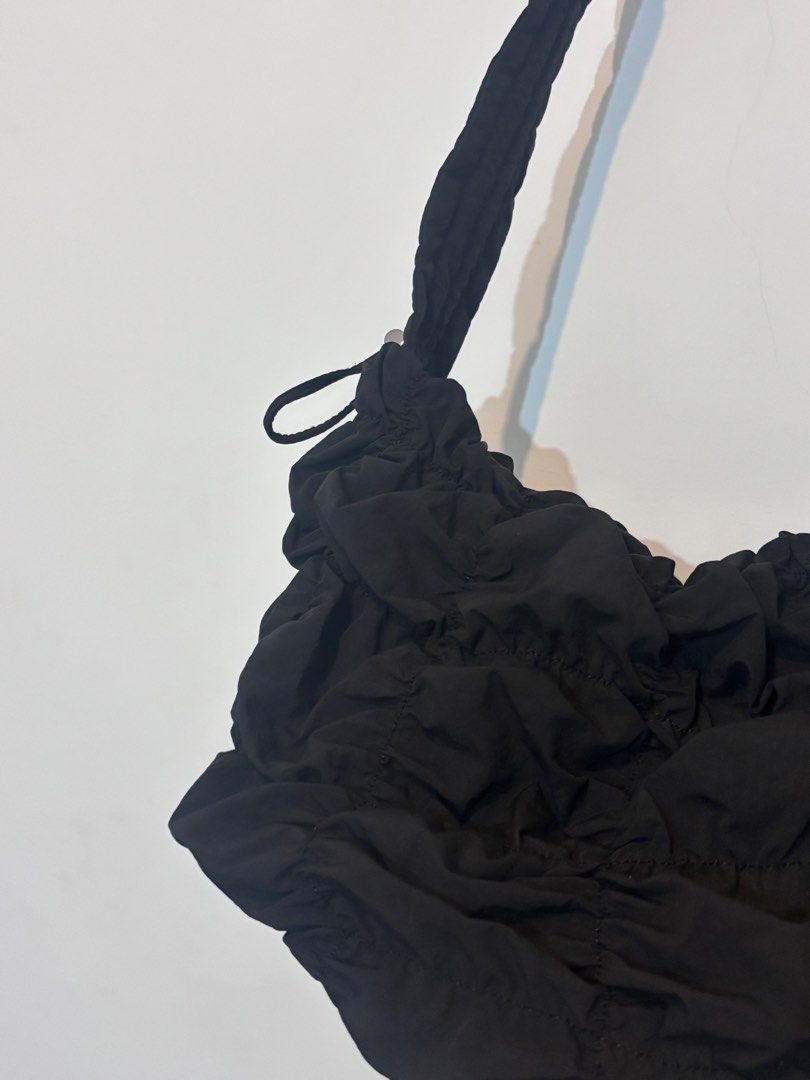 GU Black Ruched Shoulder Bag (Category: Shoulder Bags) located in Bulacan. Submitted by janeeeeelleeeee (Listing ID 1468001850, Image 2). Description: - Color: Black - Material: Soft, lightweight fabric - Design: All-over gathered texture with a minimalist style - Strap: Long, comfortable braided shoulder strap - Condition: Clean inside and out, ready to use - Perfect for daily casual wear and easy to match with different outfits.