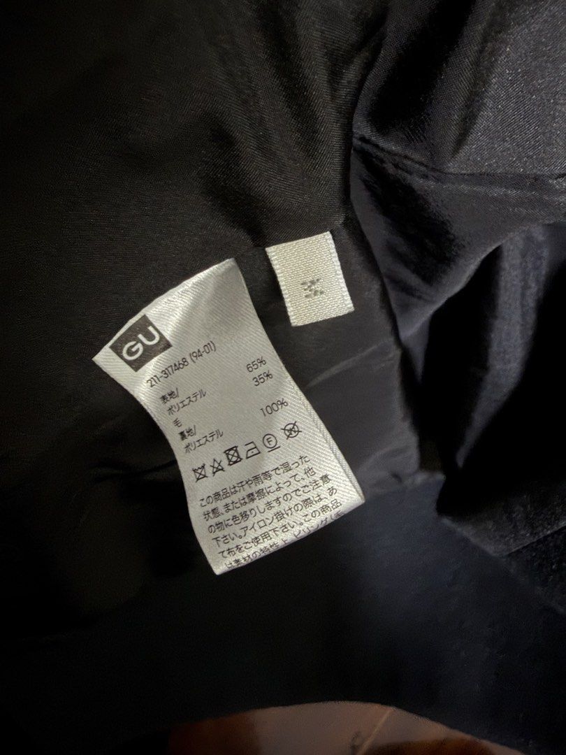 GU Black Wool Blend Long Coat Size M (Category: Coats, Jackets and Outerwear) located in Marikina City. Submitted by lucassantiano (Listing ID 1467864743, Image 3). Description: - Brand: GU - Style: Classic black long coat - Size: Medium (M) - Material: 65% polyester, 35% wool outer; 100% polyester lining - Features: Lapel collar, two front-button closure, flap pockets, fully lined - Condition: Good, needs a quick lint roll due to storage.