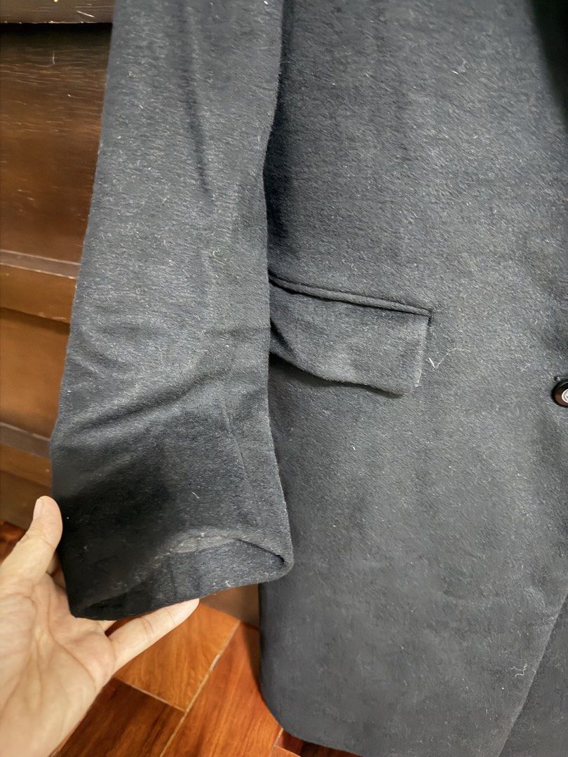 GU Black Wool Blend Long Coat Size M (Category: Coats, Jackets and Outerwear) located in Marikina City. Submitted by lucassantiano (Listing ID 1467864743, Image 2). Description: - Brand: GU - Style: Classic black long coat - Size: Medium (M) - Material: 65% polyester, 35% wool outer; 100% polyester lining - Features: Lapel collar, two front-button closure, flap pockets, fully lined - Condition: Good, needs a quick lint roll due to storage.
