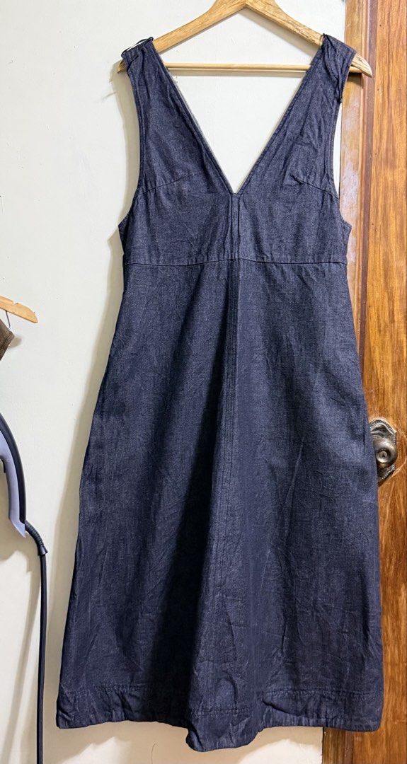 GU Denim V-Neck Maxi Dress (Category: Dresses) located in Paete. Submitted by skydruemadison (Listing ID 1467967201, Image 1). Description: - Brand: GU - Style: Denim midi dress with deep V-neckline (front and back) and sleeveless design - Color/Wash grey - Size: M-L fit - Material: 100% cotton - Features: Back zip closure and functional side pockets - Condition: Perfect for easy layering over tees or tanks.