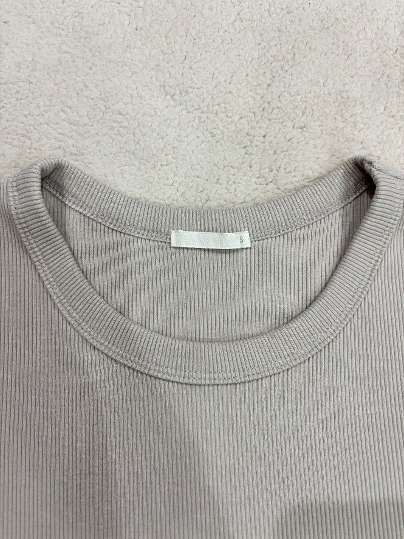 GU Ribbed Knit Short Sleeve Top Size (Category: Shirts) located in Cadiz. Submitted by soleil_montefalco (Listing ID 1467852836, Image 2). Description: - Brand: GU - Style: Ribbed knit top with crew neck and short sleeves - Color: Light Beige - Size: S (fits true to size) - Material: Cotton, polyester, and spandex blend (soft stretch) - excellent for daily wear - We may have failed to notice some minimal stains or flaws. - NO RUSH SHIPPING & MEET