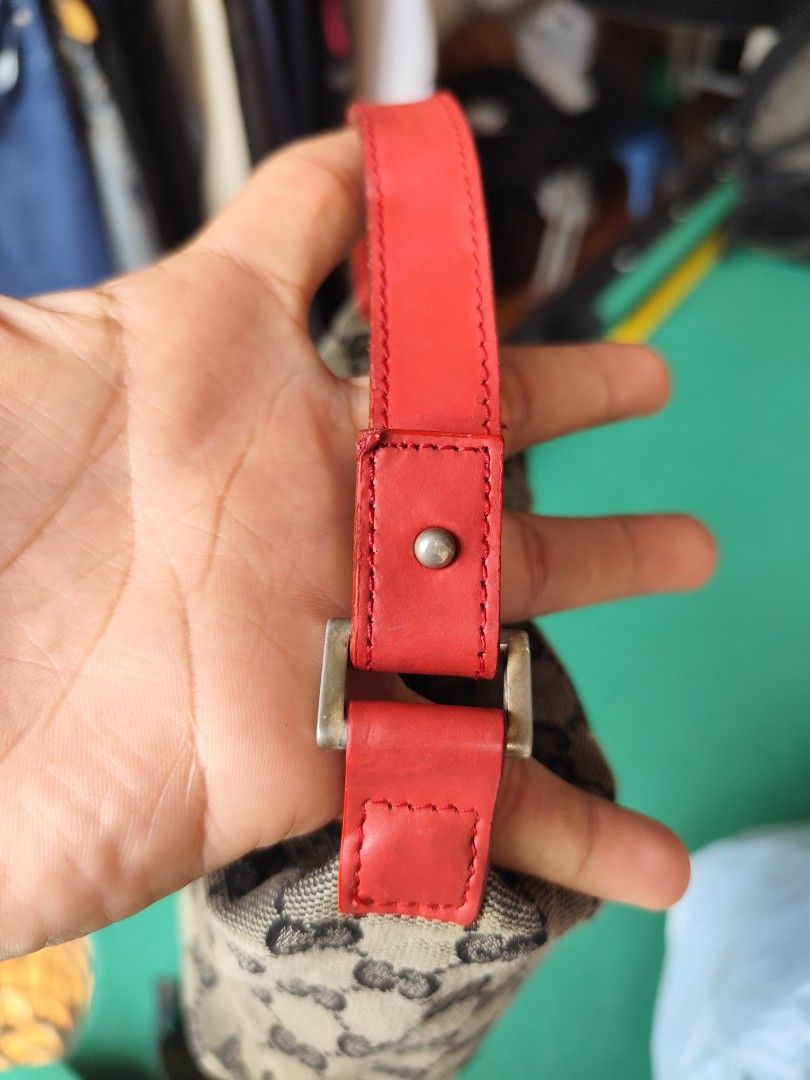 GUCCI MINI POCHETTE GG MONOGRAM (Category: Luxury Bags & Wallets) located in Cordova. Submitted by bsb.streetluxvintage.clothing (Listing ID 1467868050, Image 3). Description: - Authentic Gucci mini handbag with classic GG monogram canvas - Vibrant red leather strap and trim details - Interior red leather tag with embossed 'GUCCI made in italy' and style numbers - Clean black fabric lining - Compact size, ideal for shoulder or hand carry - DM for