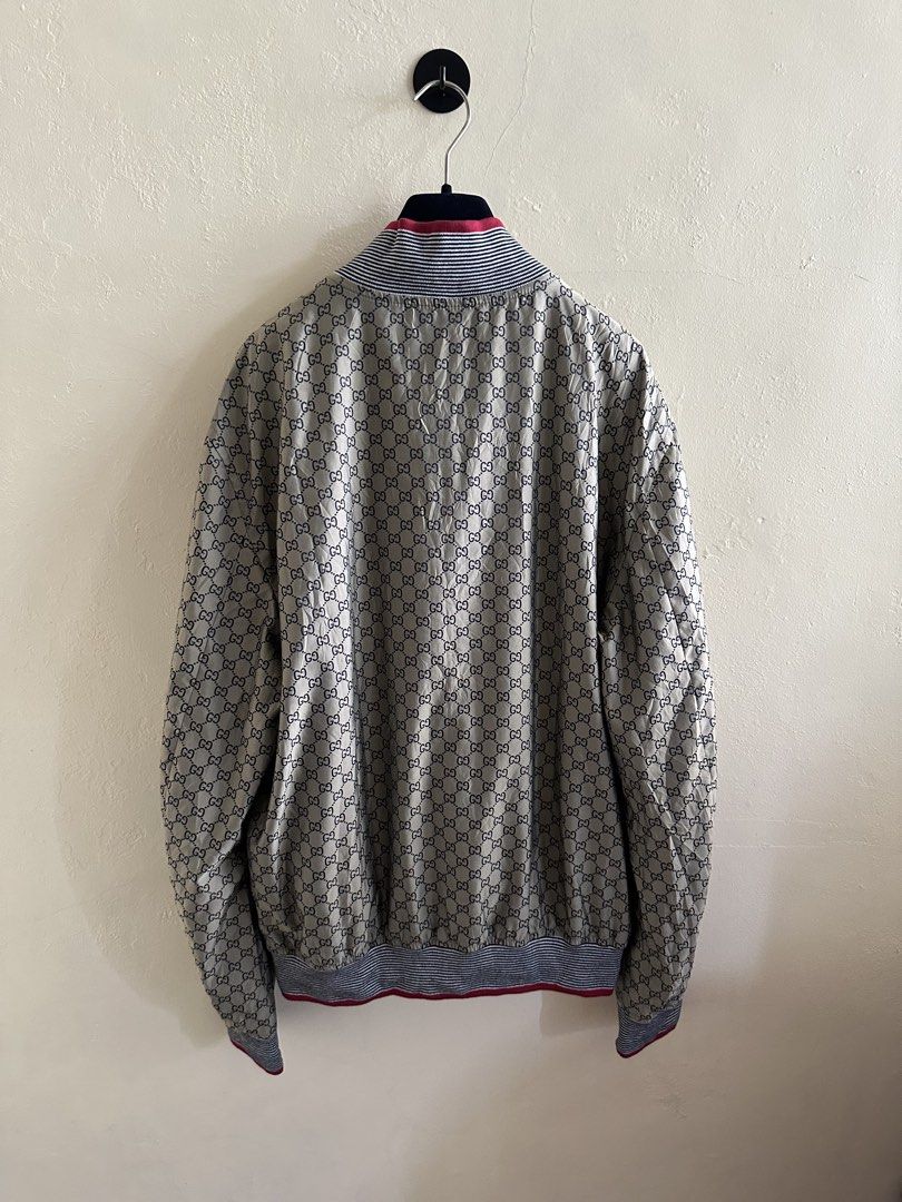 Gucci 2009 Monogram Bomber Jacket (Category: Coats, Jackets and Outerwear) located in Digos. Submitted by jayarshop (Listing ID 1467852250, Image 2). Description: - Condition: Excellent pre-owned condition. Well-maintained with clean fabric, tags intact, and smooth zipper functionality. - Size: 54 (EU) / XL, 24 x 28 - Design & Features: - Classic all-over GG monogram print on one side. - Distinctive red, white, and blue striped ribbed collar, cuf