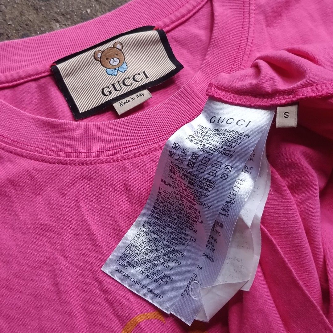 Gucci Bear Pink Tee & Louis Vuitton Pink Tee Bundle (Category: Shirts) located in Caloocan City. Submitted by gemfinder669 (Listing ID 1467904330, Image 3). Description: - Bundle of 2 pink designer tees - Item 1: Gucci t-shirt with cute bear graphic, Size S, 100% cotton, Made in Italy - Item 2: Louis Vuitton pink tee with white embroidered LV floral motif, Size M - Both items feature original tags with branding and care instructions - Vibrant pin