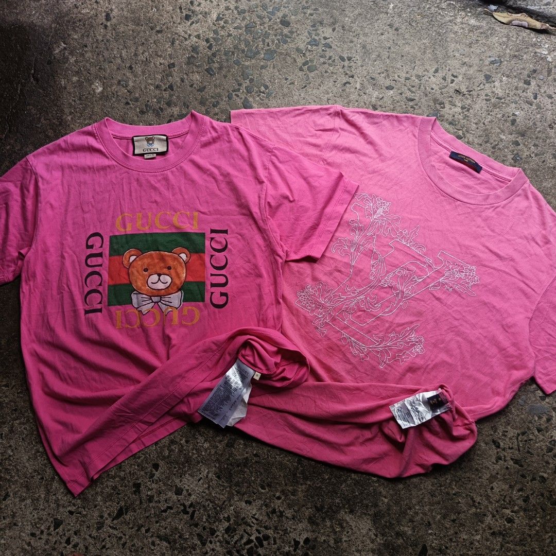 Gucci Bear Pink Tee & Louis Vuitton Pink Tee Bundle (Category: Shirts) located in Caloocan City. Submitted by gemfinder669 (Listing ID 1467904330, Image 1). Description: - Bundle of 2 pink designer tees - Item 1: Gucci t-shirt with cute bear graphic, Size S, 100% cotton, Made in Italy - Item 2: Louis Vuitton pink tee with white embroidered LV floral motif, Size M - Both items feature original tags with branding and care instructions - Vibrant pin