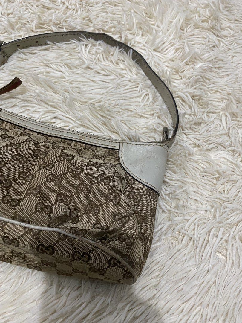 Gucci GG Monogram Canvas PROJECT BAG (Category: Shoulder Bags) located in Manila. Submitted by switchcity (Listing ID 1467877725, Image 3). Description: - Authentic Gucci shoulder bag in classic brown monogram canvas - Chic white leather trim details on the corners - Matching adjustable shoulder strap for comfortable wear - Secure top zipper closure with a sleek leather pull - Compact size, ideal for your everyday essentials - Message us for more