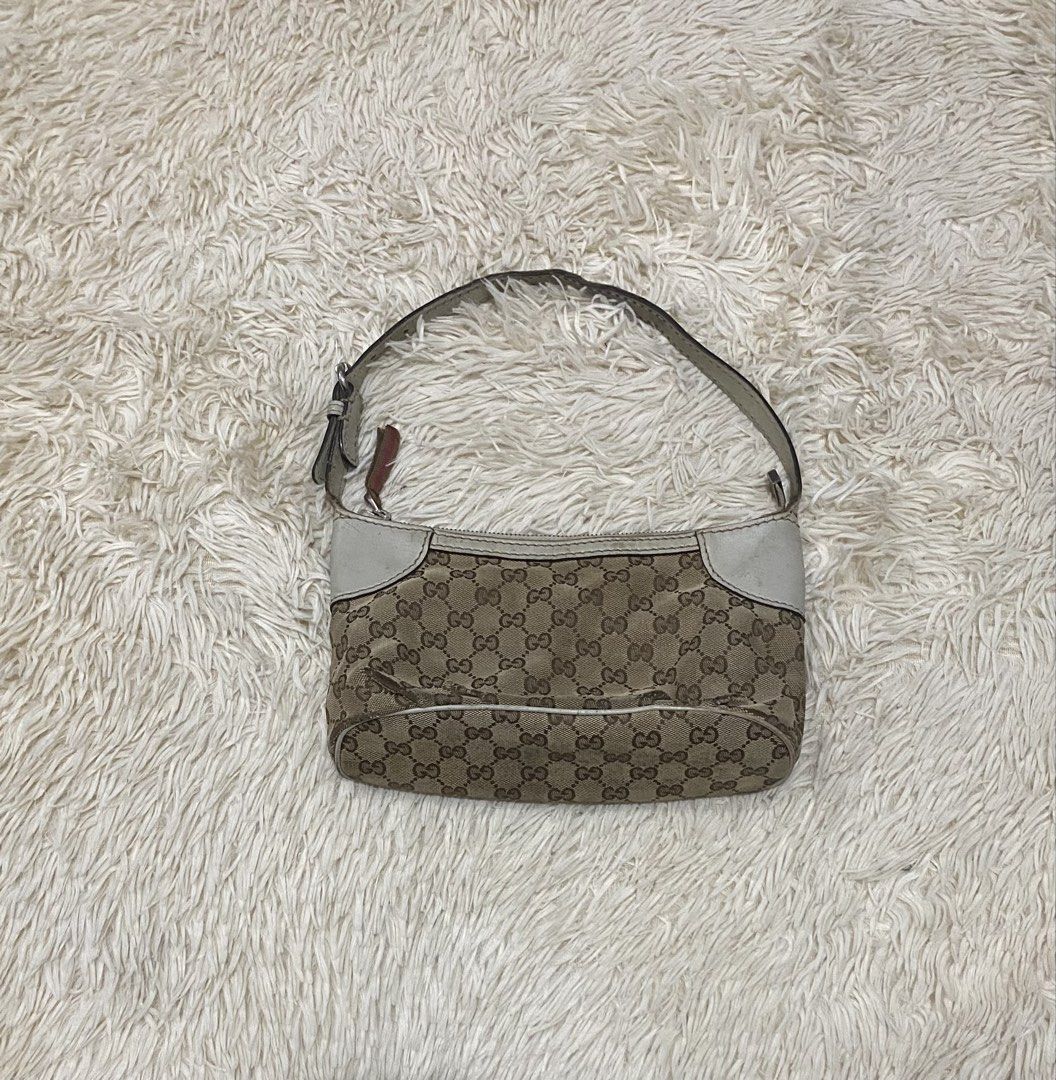 Gucci GG Monogram Canvas PROJECT BAG (Category: Shoulder Bags) located in Manila. Submitted by switchcity (Listing ID 1467877725, Image 1). Description: - Authentic Gucci shoulder bag in classic brown monogram canvas - Chic white leather trim details on the corners - Matching adjustable shoulder strap for comfortable wear - Secure top zipper closure with a sleek leather pull - Compact size, ideal for your everyday essentials - Message us for more