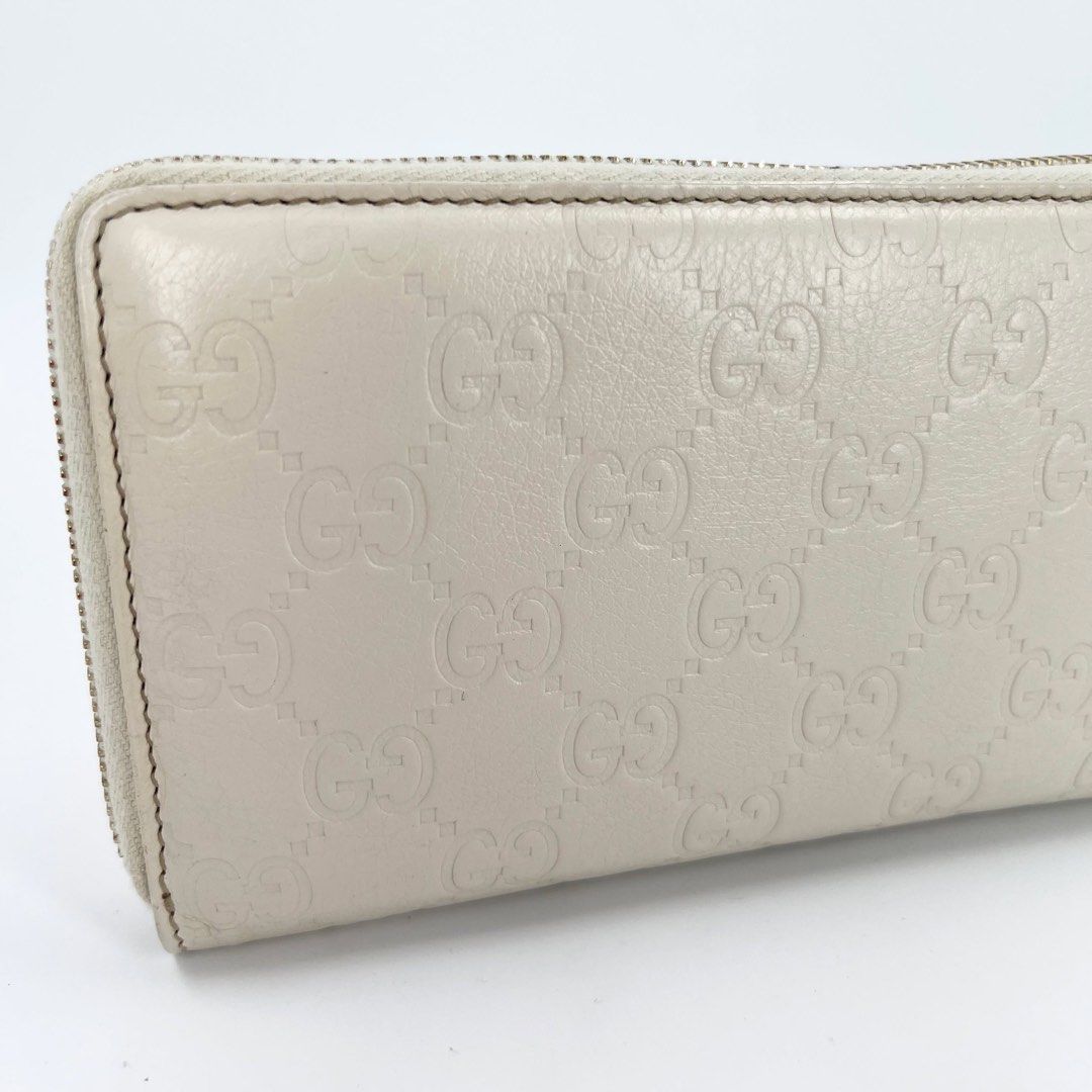 Gucci Guccissima White Zippy Long Wallet (Category: Wallets & Card Holders) located in Mandaluyong City. Submitted by huntervip (Listing ID 1467897697, Image 2). Description: - Brand: Gucci - Style: Guccissima zip-around long wallet - Color: White with allover debossed GG pattern - Hardware: Interlocking G pull charm - Interior: Genuine leather with Gucci made in Italy logo stamp - Authentication: Includes official certificate of authenticity fro