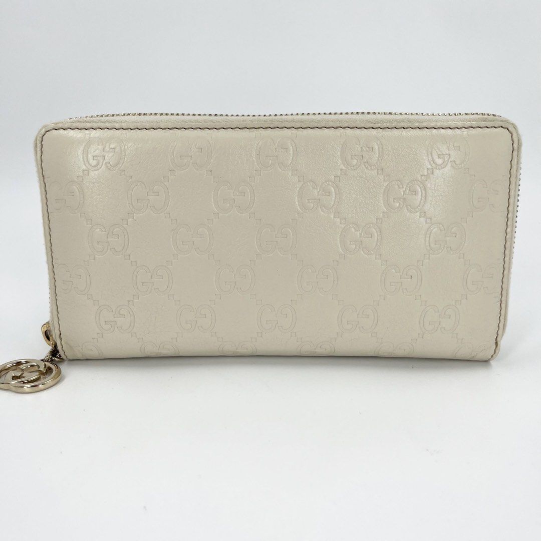 Gucci Guccissima White Zippy Long Wallet (Category: Wallets & Card Holders) located in Mandaluyong City. Submitted by huntervip (Listing ID 1467897697, Image 1). Description: - Brand: Gucci - Style: Guccissima zip-around long wallet - Color: White with allover debossed GG pattern - Hardware: Interlocking G pull charm - Interior: Genuine leather with Gucci made in Italy logo stamp - Authentication: Includes official certificate of authenticity fro