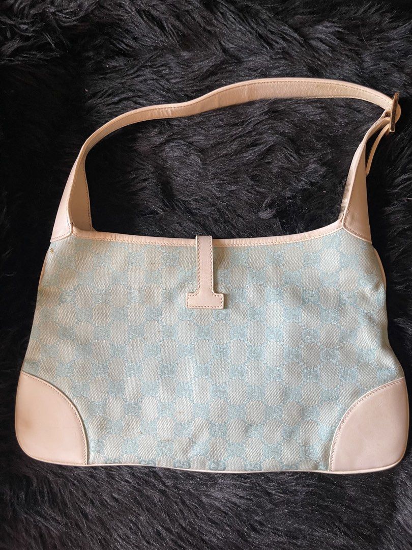 Gucci Jackie Monogram Shoulder Bag (Category: Luxury Bags & Wallets) located in Davao. Submitted by boodle4lyf (Listing ID 1467922723, Image 3). Description: Authentic Gucci Jackie shoulder bag in rare light blue and cream GG monogram canvas with white leather trim. Features classic silver hardware and adjustable strap. Condition is very good but the main concern is the tiny spot stains at the back. Stains are removable. .