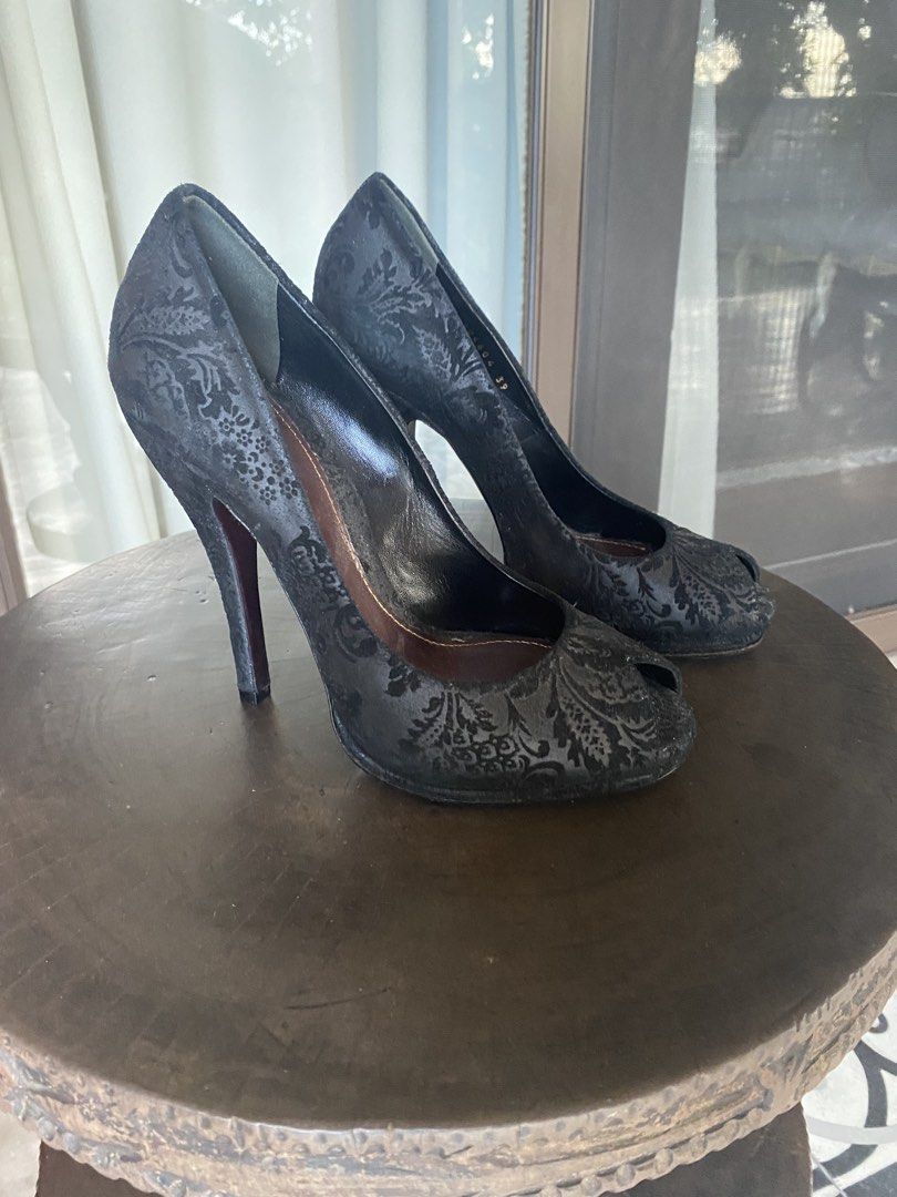 Gucci Peep Toe Stiletto Heels (Category: Heels) located in San Juan City. Submitted by ana.gpadilla (Listing ID 1467843183, Image 2). Description: - Brand: Gucci - Price: PHP8,000 - Retail Price: $650 - Lining Material: Leather - Exterior Material: Suede, Leather - Color: Black - Style: Gucci Elizabeth, Peep toe heels with high stiletto and platform - Heel Size: 13 CM - Design: Intricate damask pattern throughout in classic black - Interior & Sol