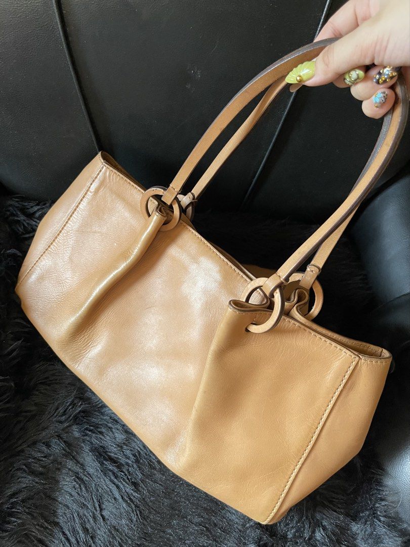 Gucci Tan Leather Shoulder Bag with Pouch (Category: Luxury Bags & Wallets) located in Davao. Submitted by boodle4lyf (Listing ID 1467916523, Image 2). Description: G.A Gucci shoulder bag with pouch. In good used condition with minimal signs of usage only. Interior has pen marks. Pouch is built in and serial number for the bag is there. .