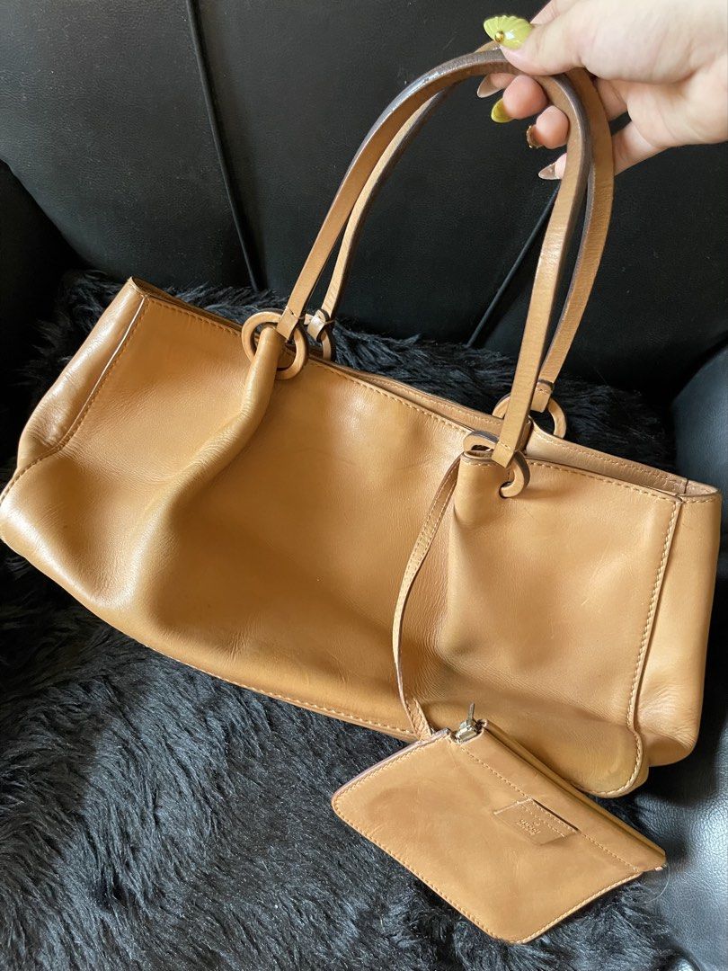 Gucci Tan Leather Shoulder Bag with Pouch (Category: Luxury Bags & Wallets) located in Davao. Submitted by boodle4lyf (Listing ID 1467916523, Image 1). Description: G.A Gucci shoulder bag with pouch. In good used condition with minimal signs of usage only. Interior has pen marks. Pouch is built in and serial number for the bag is there. .