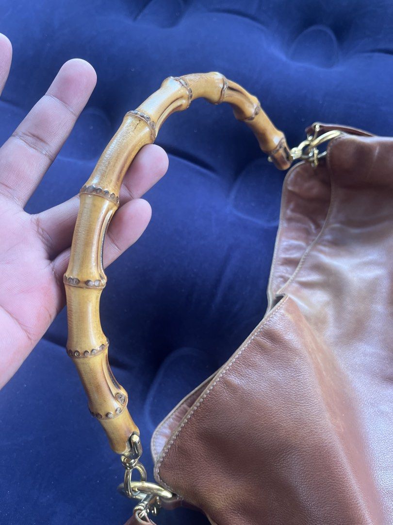 Gucci tom ford vintage bamboo two way (Category: Shoulder Bags) located in Tacloban City. Submitted by luxbag_phhh (Listing ID 1467848191, Image 3). Description: Authentic tom ford era gucci brown leather shoulder bag featuring a distinctive bamboo top handle and brass hardware. Includes a matching long leather strap for versatile wear. Soft slouchy structure with gold piping accents along the edges. Great everyday size with plenty of room inside