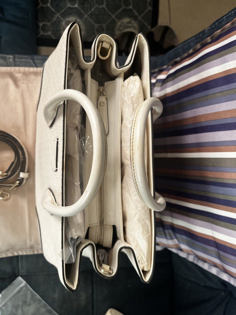 Authentic Gucci White Diamante Tote Bag (Category: Luxury Bags & Wallets) located in Makati City. Submitted by mintbags (Listing ID 1467918265, Image 3). Description: - Authentic Gucci tote in classic cream Diamante pattern - Versatile design with leather top handles and detachable shoulder strap - Structured shape with multiple internal compartments and zippered middle section - Clean interior lining with original protective paper stuffing intac