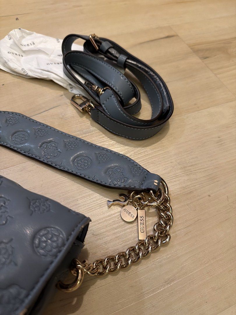 Guess bag with chain and strap (new) (Category: Shoulder Bags) located in Manila. Submitted by _____car0usell (Listing ID 1467986705, Image 3). Description: bought from US never used, just stuck in the closet straps are removable depending on your style still with original stuffing papers see noticeable flaking due to storage.
