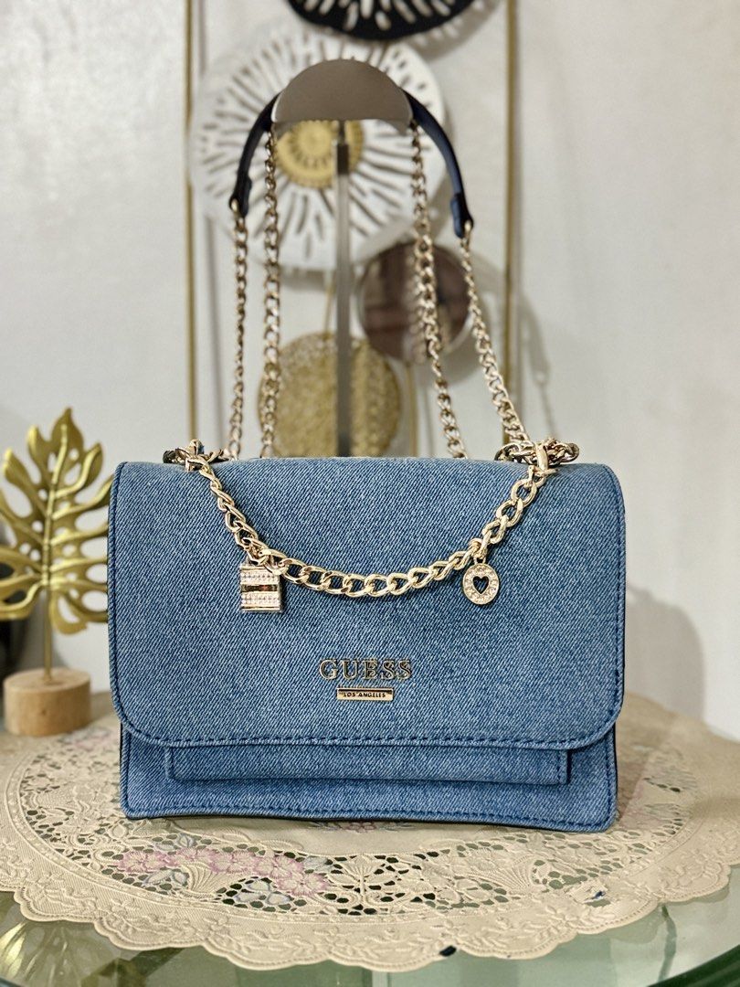 Guess Denim Convertible Chain (Category: Shoulder Bags) located in Cainta. Submitted by angellyy_ (Listing ID 1467896660, Image 1). Description: Just Arrived from Canada!! Brandnew Guess Denim Convertible Chain Sling / Shoulder W/ bag charm 3 compartment inside Small size.