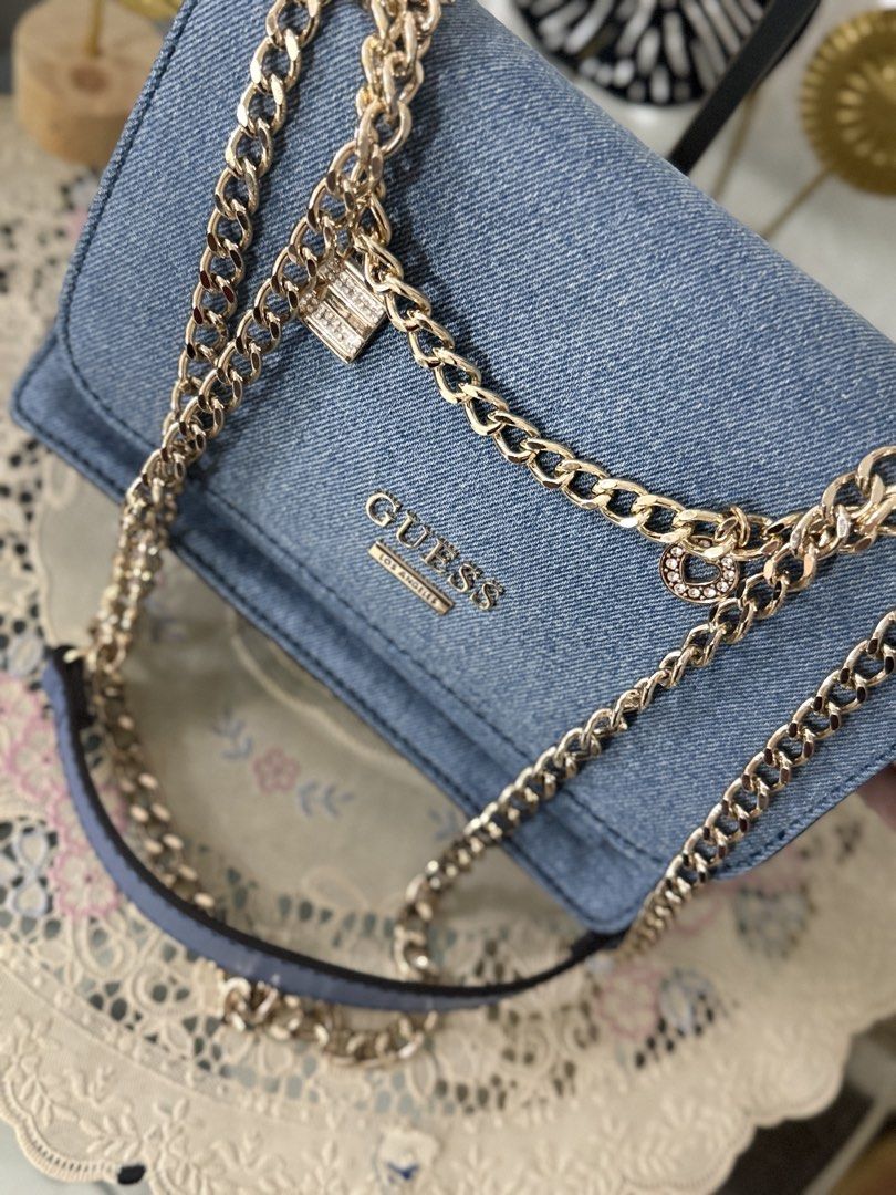 Guess Denim Convertible Chain (Category: Shoulder Bags) located in Cainta. Submitted by angellyy_ (Listing ID 1467896660, Image 3). Description: Just Arrived from Canada!! Brandnew Guess Denim Convertible Chain Sling / Shoulder W/ bag charm 3 compartment inside Small size.