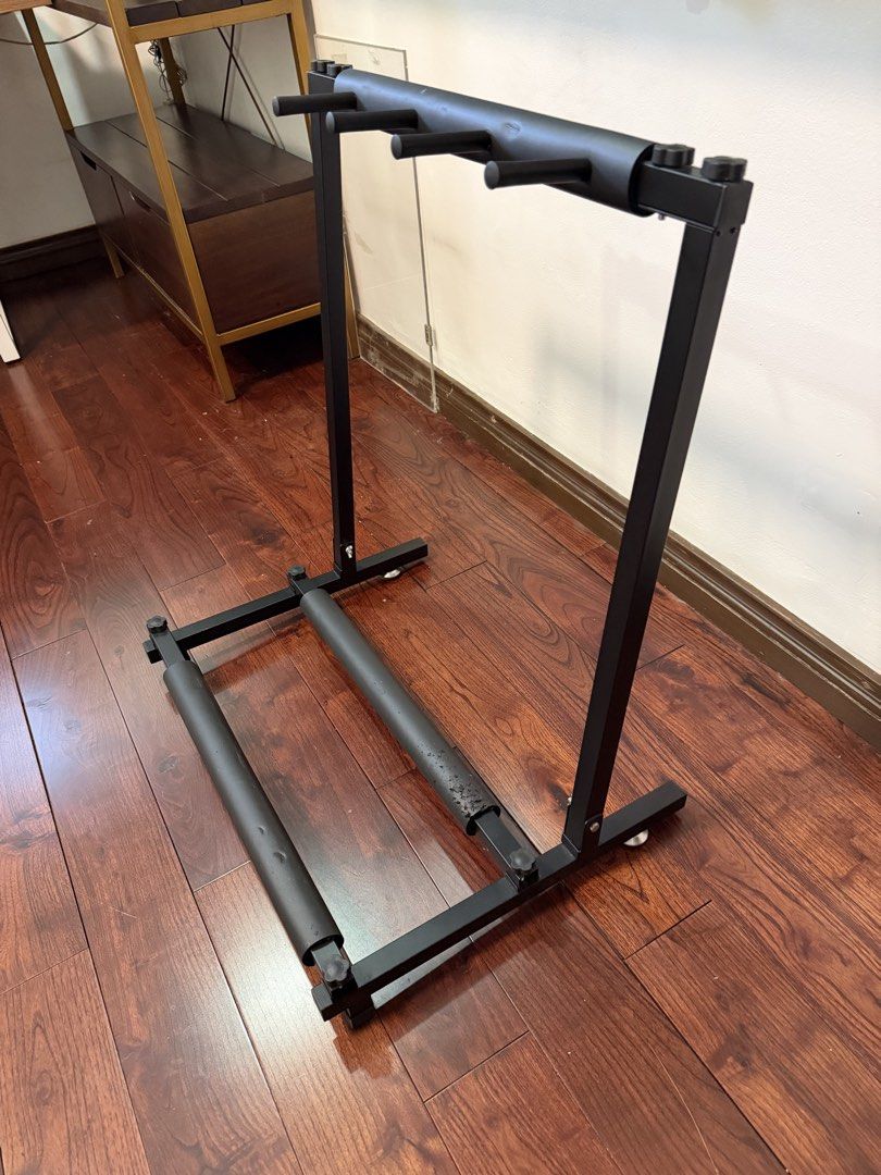 Guitar Rack Stand Heavy Duty Black (Category: Musical Instruments) located in Makati City. Submitted by monkeykingo (Listing ID 1467972095, Image 1). Description: - Heavy-duty black metal frame for maximum stability - Foam padding on neck dividers and base rails to prevent scratches - Multi-guitar capacity to hold several instruments safely - Easy to disassemble, assemble, and adjust - Space-saving design ideal for studios, bedrooms, or jamming s