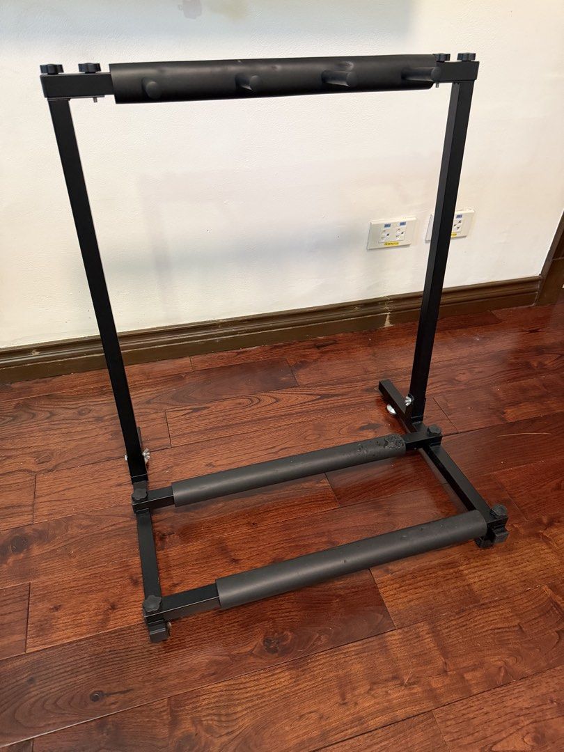 Guitar Rack Stand Heavy Duty Black (Category: Musical Instruments) located in Makati City. Submitted by monkeykingo (Listing ID 1467972095, Image 3). Description: - Heavy-duty black metal frame for maximum stability - Foam padding on neck dividers and base rails to prevent scratches - Multi-guitar capacity to hold several instruments safely - Easy to disassemble, assemble, and adjust - Space-saving design ideal for studios, bedrooms, or jamming s