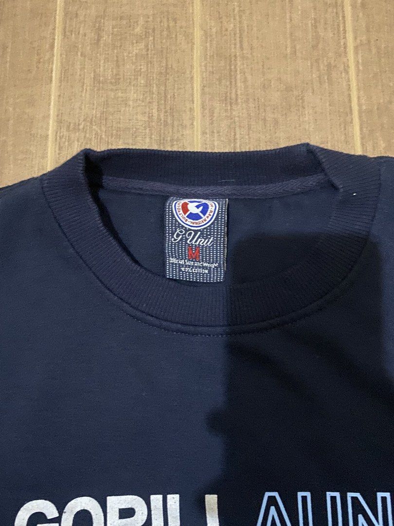 G-Unit GorillAunit Heavyweight Navy Sweatshirt Size M (Category: Coats, Jackets and Outerwear) located in Bacoor. Submitted by jabbawantkiss (Listing ID 1467993485, Image 2). Description: - Brand: G-Unit - Color: Navy Blue - Size: Medium - Design: Bold "GORILLA UNIT" text graphic on front - Material: 100% heavyweight cotton - Measurements: 22 inches pit to pit, 26 inches length - Features: Classic ribbed cuffs and hem.