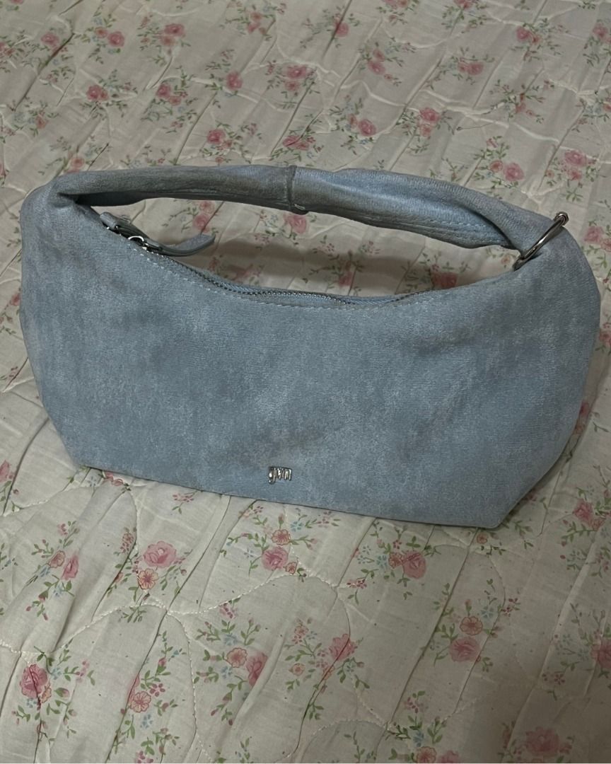 [GVN] Light Blue Suede Midi Hobo (Category: Shoulder Bags) located in Las Pinas. Submitted by rawrmona (Listing ID 1467963595, Image 1). Description: - Color & Material: Light blue soft suede with matching fabric lining - Hardware: Silver-tone metal details and small brand logo on the front - Closure: Secure top zip closure - Handle: Short handle attached with silver hardware - Condition: Clean interior!! minor stains near handle, can be washed/c