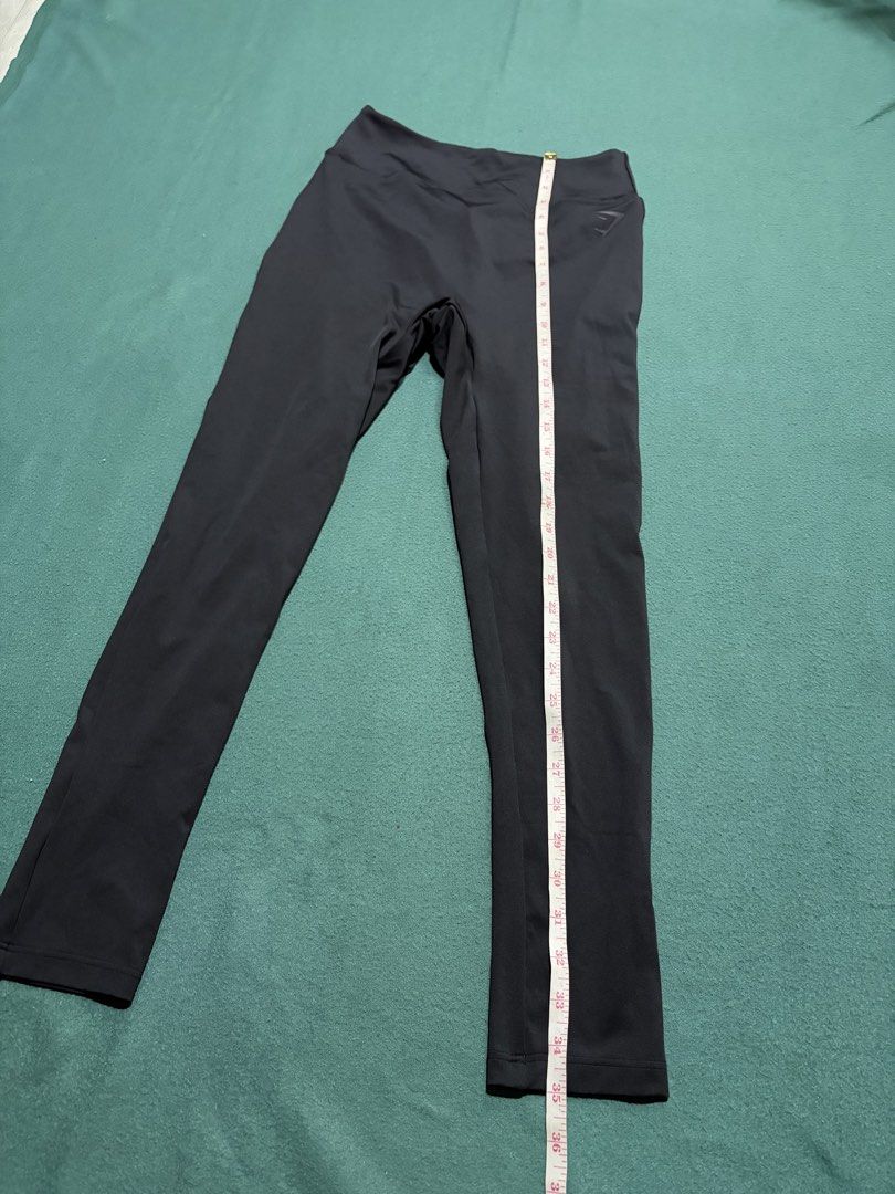Gymshark Black Leggings (Category: Activewear) located in Guihulngan. Submitted by fbthriftgoodsniace (Listing ID 1467916076, Image 2). Description: Gymshark black leggings with the classic logo stamped near the waistband. High-waisted design, great stretch for workouts or lounging. Total length measures around 35.5 inches, waist flat lay is about 13 inches across. Super soft, breathable fabric. No flaws, clean and ready to wear..