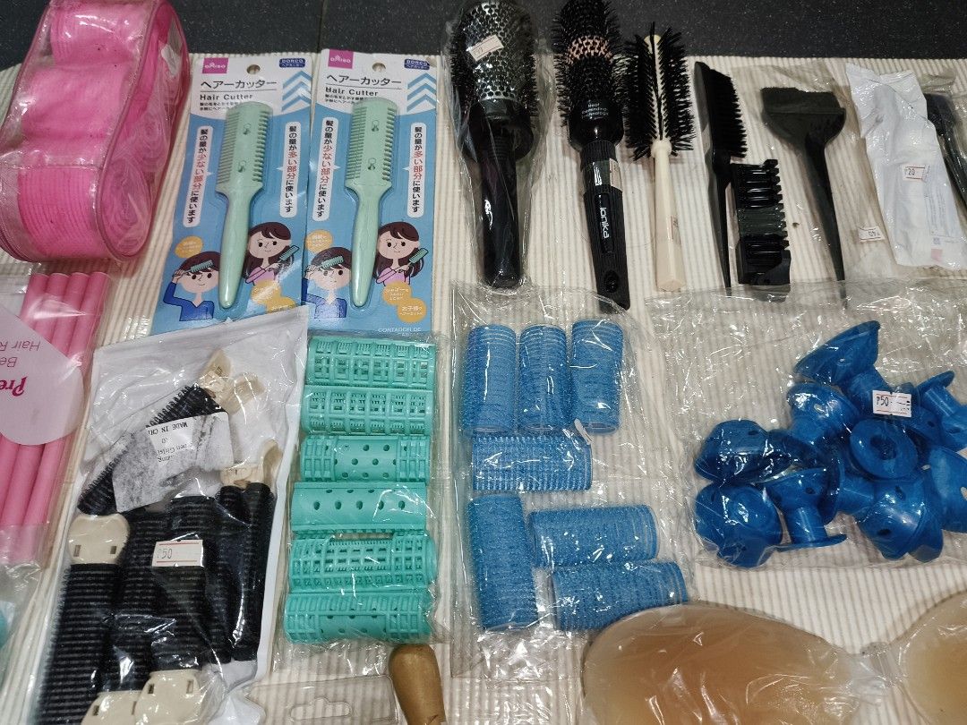 Hair styling tools, rollers, brushes and accessories bundle (Category: Hair) located in Manila. Submitted by reascheyss51406 (Listing ID 1467954101, Image 2). Description: - All-in-one hair care and beauty bundle perfect for home styling - Includes hair cutters, round brushes, and colorful hair rollers - Comes with sectioning clips and a tint brush - Bonus items: silicone push-up bra inserts and scalp massagers - Items are mostly new in packaging