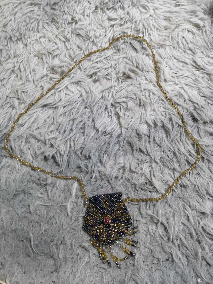 Handcrafted Beaded Pendant Necklace (Category: Necklaces) located in Santa Cruz. Submitted by jmy_surplus.2 (Listing ID 1467911204, Image 1). Description: Size ; L - 19 W - 2.4 Color ; Blue , Yellow Type ; Necklace Brand ; No Brand Material ; Pearl Style ; Cute & Durable Beaded necklace LG 117 JMY 3 Batch #225.