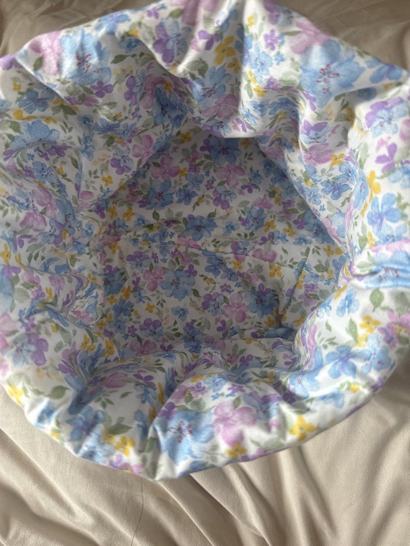 Handmade Large Storage Basket Bin (Category: Storage Boxes & Baskets) located in Makati City. Submitted by shaniahdeclutters (Listing ID 1467857336, Image 2). Description: - Soft fabric storage basket with a charming blue, purple, and yellow floral pattern - Crisp white background with clean interior and exterior - Features collapsible sides for easy storage when not in use - Perfect for organizing makeup, toiletries, or small desk and shelf item