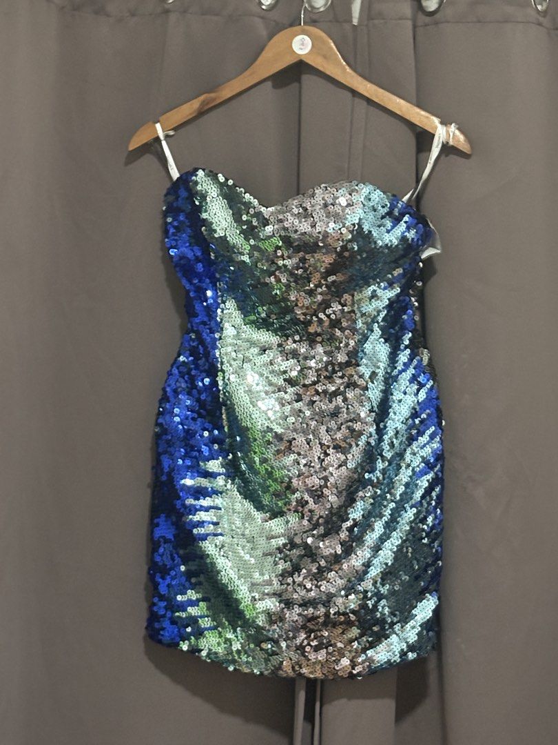 Hannah S strapless sequin dress blue and silver (Category: Evening dresses & gowns) located in Cabuyao City. Submitted by airpz (Listing ID 1467993403, Image 1). Description: - Brand: Hannah S - Style: Strapless, bodycon mini dress - Design: Blue side panel with a stunning silver and green gradient covered in sequins - Features: Catches the light amazingly, includes hanging straps - Fit: Standard size, hugs the curves perfectly - Condition: Great