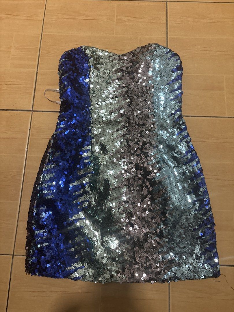 Hannah S strapless sequin dress blue and silver (Category: Evening dresses & gowns) located in Cabuyao City. Submitted by airpz (Listing ID 1467993403, Image 2). Description: - Brand: Hannah S - Style: Strapless, bodycon mini dress - Design: Blue side panel with a stunning silver and green gradient covered in sequins - Features: Catches the light amazingly, includes hanging straps - Fit: Standard size, hugs the curves perfectly - Condition: Great