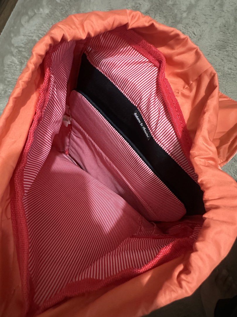 Herschel orange drawstring backpack (Category: Backpacks) located in Makati City. Submitted by cysamson01 (Listing ID 1467865231, Image 3). Description: Herschel orange drawstring backpack.