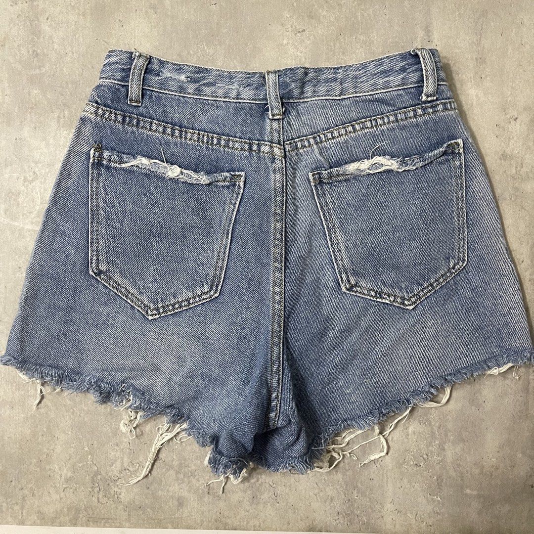 High waisted distressed soft denim shorts raw hem (Category: Shorts) located in General Trias. Submitted by 1992thelabel (Listing ID 1467949801, Image 2). Description: Dimensions when laid flat: Waist: 13.5” Length: 13” Selling to feed more bellies! 🐶🐱Proceeds go to my rescue dogs, cats & strays. Your purchase would mean a lot! Thank you 🐾 - Style: High-rise denim shorts in a versatile medium wash - Details: Raw frayed hem and distressed pocke