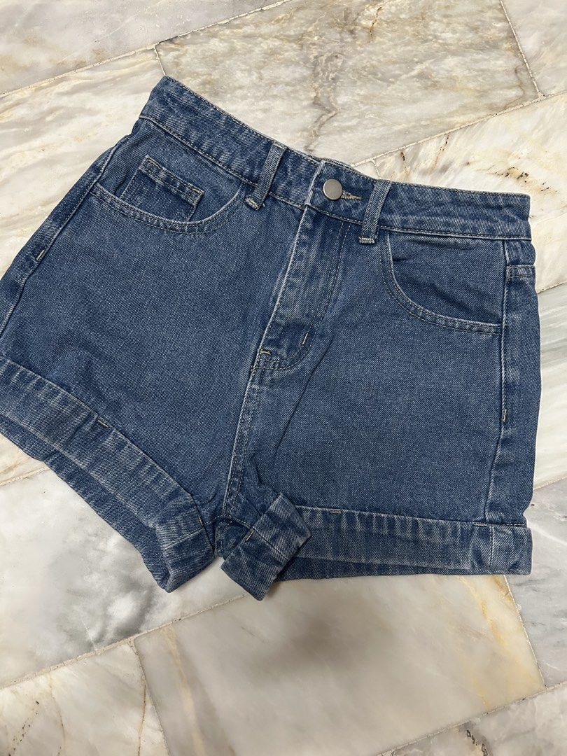 High-Waisted Denim Shorts Clean Cut (Category: Shorts) located in Paranaque City. Submitted by jeanfrommanila (Listing ID 1467955690, Image 2). Description: - Wash: Dark blue, dark wash denim - Fit & Closure: Classic five-pocket design with button closure, working zipper - Details: Features functional back patch pockets - Worn 2x only cause I got fat Dimes: (in inches) Waist: 26 Length: 12.