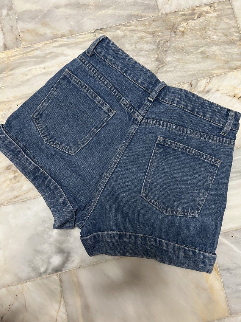 High-Waisted Denim Shorts Clean Cut (Category: Shorts) located in Paranaque City. Submitted by jeanfrommanila (Listing ID 1467955690, Image 3). Description: - Wash: Dark blue, dark wash denim - Fit & Closure: Classic five-pocket design with button closure, working zipper - Details: Features functional back patch pockets - Worn 2x only cause I got fat Dimes: (in inches) Waist: 26 Length: 12.