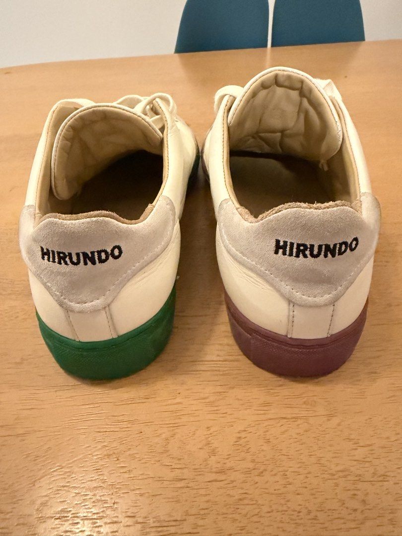 Hirundo Mismatched White Leather Casual Sneakers (Category: Sneakers) located in Cebu City. Submitted by miguelgsarmiento (Listing ID 1467990368, Image 3). Description: - Brand/Model: Hirundo leather sneakers - Design: Fun mismatched colorway with one green sole and one maroon sole - Materials: Premium white leather uppers, grey suede toe caps, and soft tan leather lining - Details: 'Hirundo' embroidered on the heel tabs with classic cream laces 