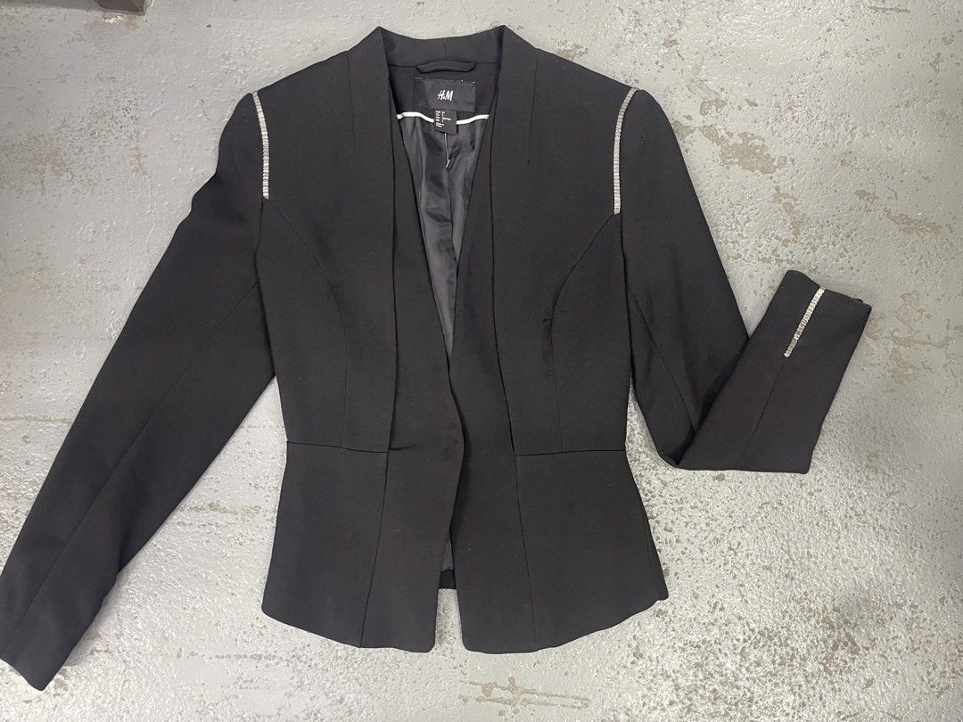 H&M Black Blazer with Rhinestone Shoulder Trim (Category: Coats, Jackets and Outerwear) located in Bulacan. Submitted by grazcloset (Listing ID 1467889682, Image 1). Description: - Brand: H&M - Color: Classic Black - Style: Open front with structured peplum waist - Details: Eye-catching rhinestone embellishments on shoulders and one sleeve cuff - Interior: Fully lined - Condition: Clean, worn only a couple of times - Versatility: Great layering p