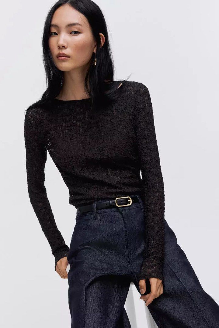 H&M Black Textured Long Sleeve Blouse (Category: Longsleeves) located in Manila. Submitted by monami_86 (Listing ID 1468003941, Image 1). Description: * Brand: H&M * Product Name: Textured long-sleeved top * Design: Black long-sleeve top featuring a boat neckline and a crinkled, popcorn-textured stretch fabric. * Size: EUR L / US L (CN 170/104B) * Condition: Brand New with Tags (BNWT) Payment Options: GCash Maya (Full payment required prior to it