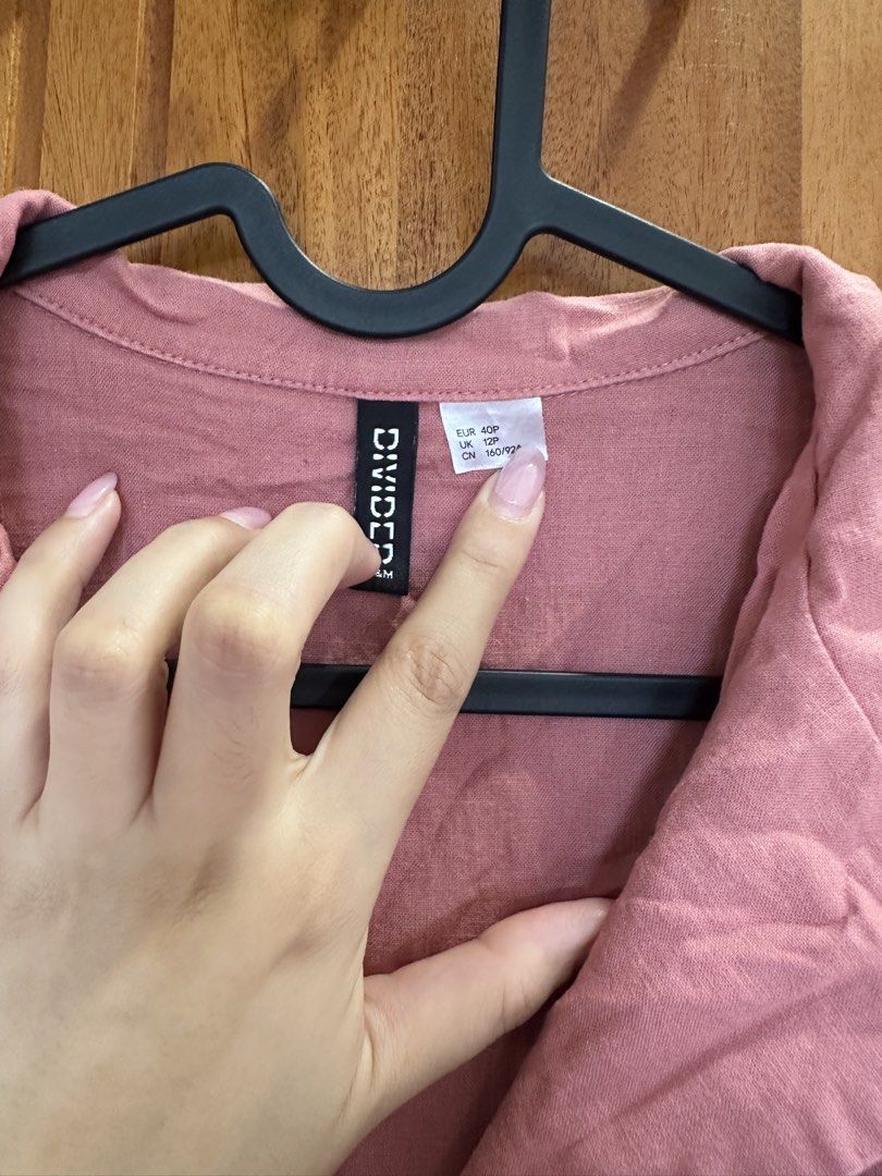 H&M Divided Pink Collared Romper (Category: Rompers) located in Makati City. Submitted by shopwithbq (Listing ID 1467944916, Image 2). Description: - Brand: H&M Divided - Item: Pink short-sleeve romper - Size: EUR 40P / UK 12P / CN 160/92A - Details: Lapel collar, button-down front with tortoiseshell buttons, left chest pocket, roll-up sleeve cuffs - Condition: Great fabric condition, just needs an iron - Style: Perfect for sunny days and warm we