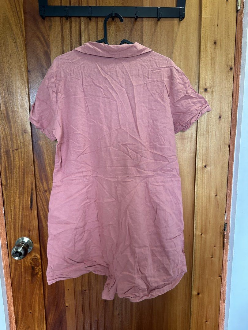 H&M Divided Pink Collared Romper (Category: Rompers) located in Makati City. Submitted by shopwithbq (Listing ID 1467944916, Image 3). Description: - Brand: H&M Divided - Item: Pink short-sleeve romper - Size: EUR 40P / UK 12P / CN 160/92A - Details: Lapel collar, button-down front with tortoiseshell buttons, left chest pocket, roll-up sleeve cuffs - Condition: Great fabric condition, just needs an iron - Style: Perfect for sunny days and warm we