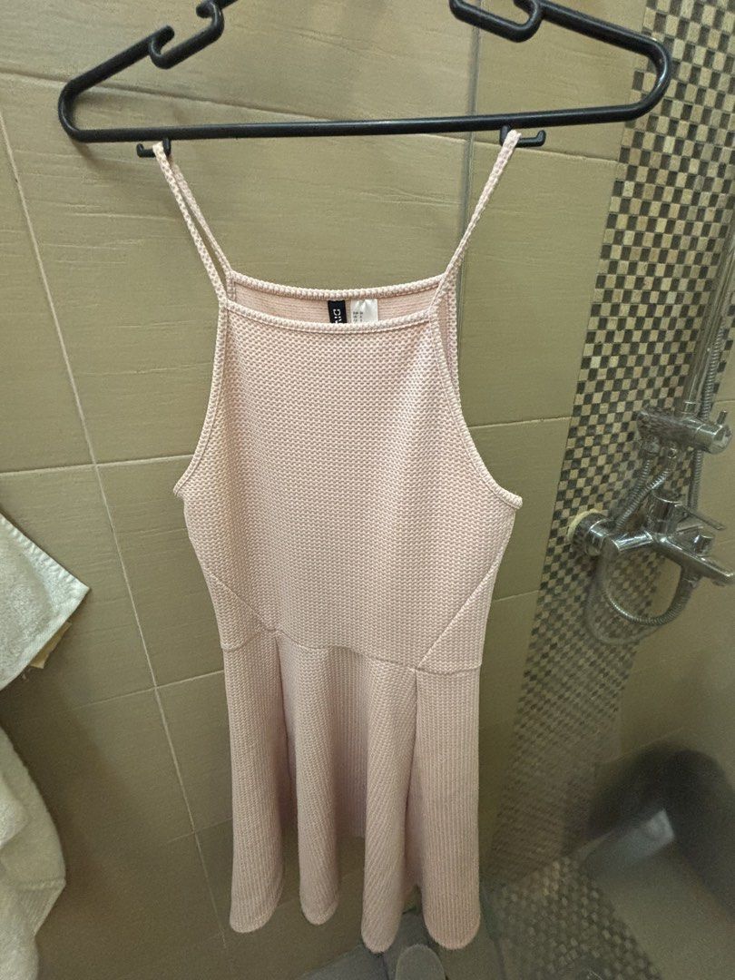 H&M Divided Pink Spaghetti Strap Dress (Category: Dresses) located in Caloocan City. Submitted by wildbird_086d1b (Listing ID 1467972495, Image 1). Description: - Brand: H&M Divided - Color: Pink - Size: EUR 36 / US 6 - Material: Textured knit fabric - Design: Square neckline, thin straps, fitted waist, and skater skirt - Condition: Great basic piece - Styling: Easy to dress up for nights out or down for casual days.